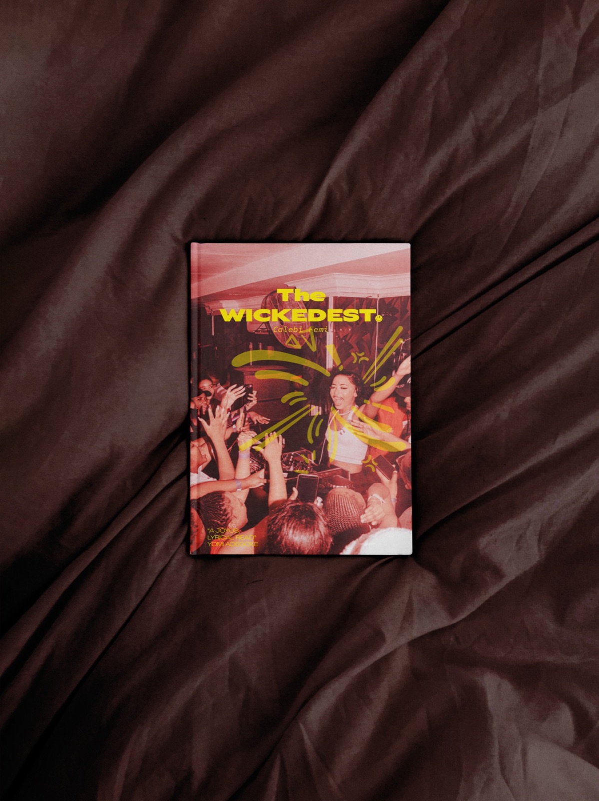The Wickedest by Caleb Femi — hardcover book flat-lay on fabric